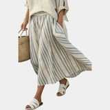 Aurora | Comfortable blouse and striped midi skirt