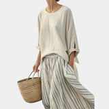 Aurora | Comfortable blouse and striped midi skirt